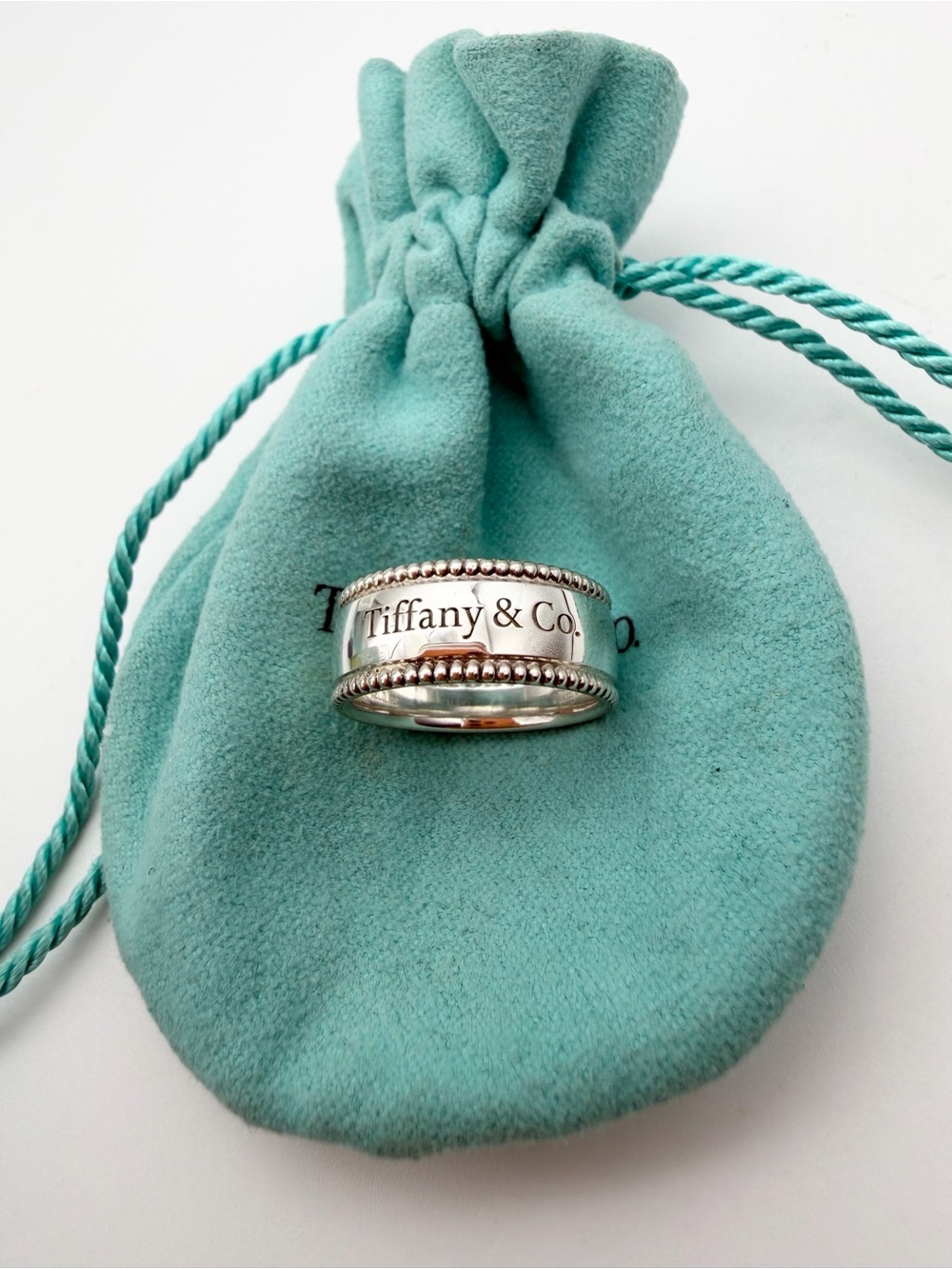 Tiffany & Co. size 6.5 “Tiffany & Co.” Script Notes Band Ring Silver